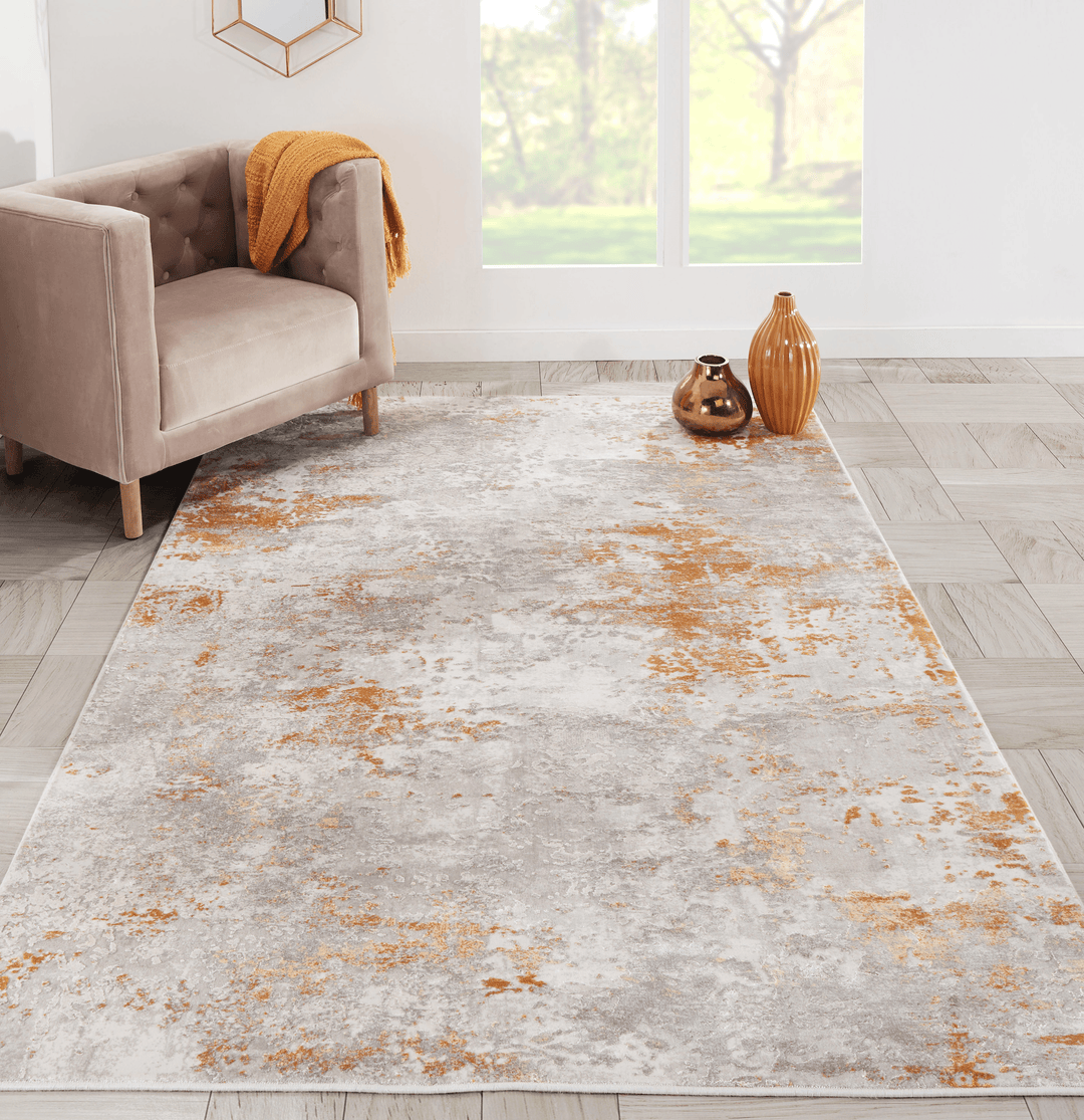 Cozy living room styled with a textured area rug and warm, inviting decor