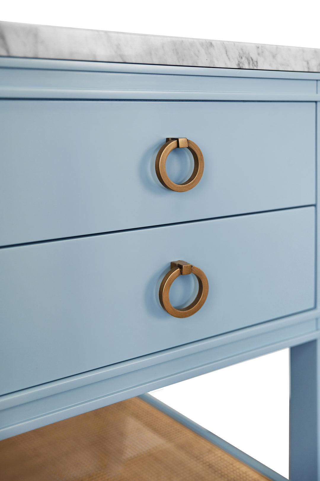 Bath Vanity In Matte Light Blue Lacquer With Open Cane Shelf, White Marble Top, Porcelain Sink, And Antique Brass Ring Hardware - CUTLER 24 LB