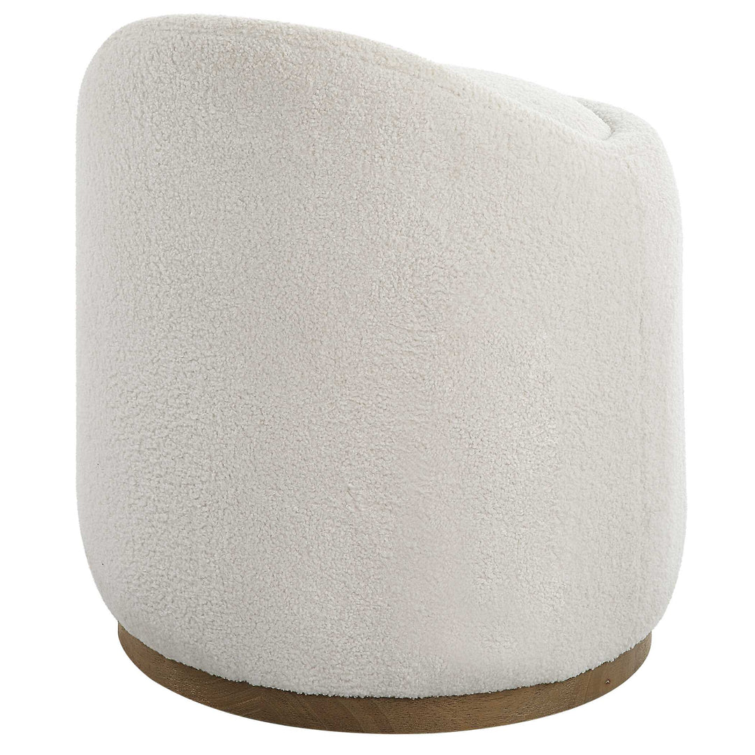 American Home Furniture Uttermost Swirl Swivel Sheepskin Ottoman