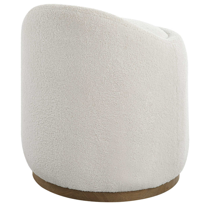 American Home Furniture Uttermost Swirl Swivel Sheepskin Ottoman