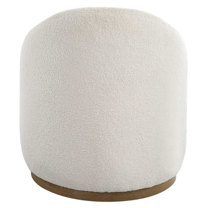 American Home Furniture Uttermost Swirl Swivel Sheepskin Ottoman