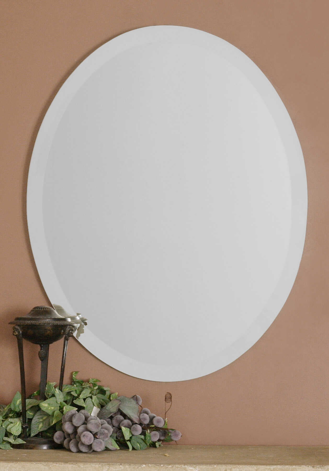 American Home Furniture Uttermost Frameless Vanity Oval Mirror