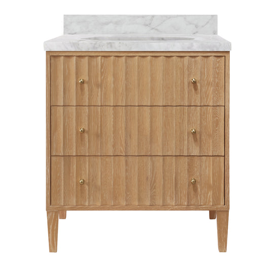 Bath Vanity With Vertical Fluted Detail On Drawers In Cerused Oak With White Marble Top, Porcelain Sink, And Polished Brass Knobs - ODIN CO