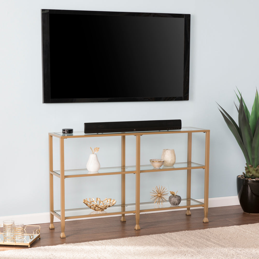 American Home Furniture | SEI Furniture - Jaymes Narrow Metal Console Table w/ Glass Shelves - Gold