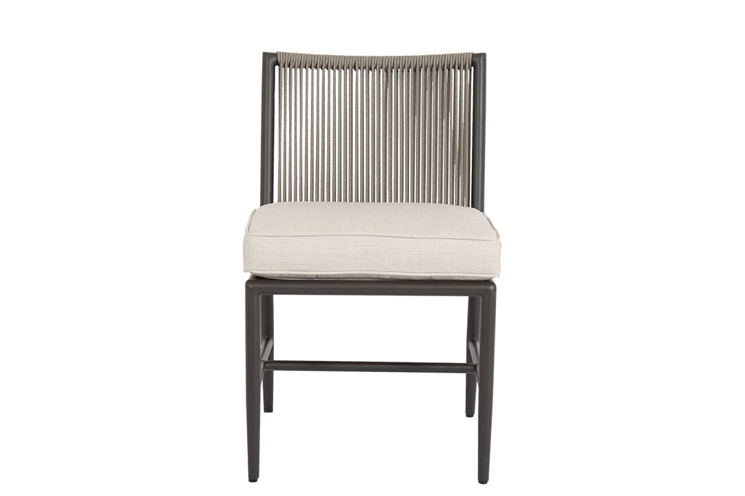 American Home Furniture | Sunset West - Pietra Armless Dining Chair in Echo Ash, No Welt