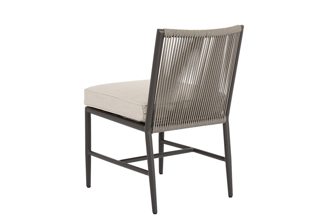 American Home Furniture | Sunset West - Pietra Armless Dining Chair in Echo Ash, No Welt