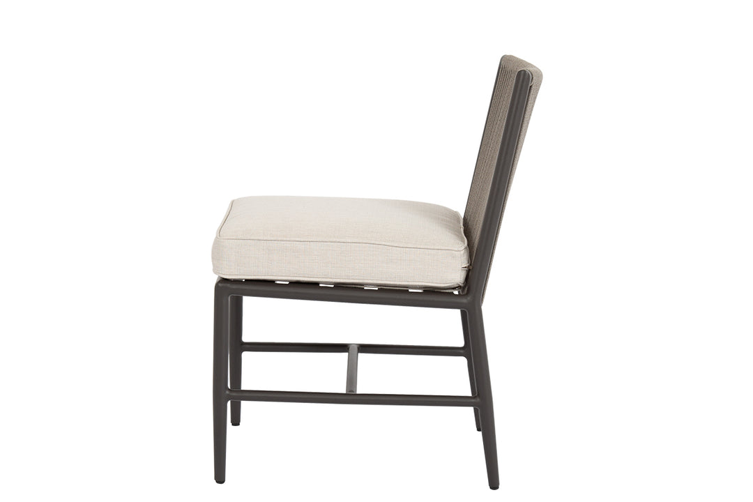 American Home Furniture | Sunset West - Pietra Armless Dining Chair in Echo Ash, No Welt