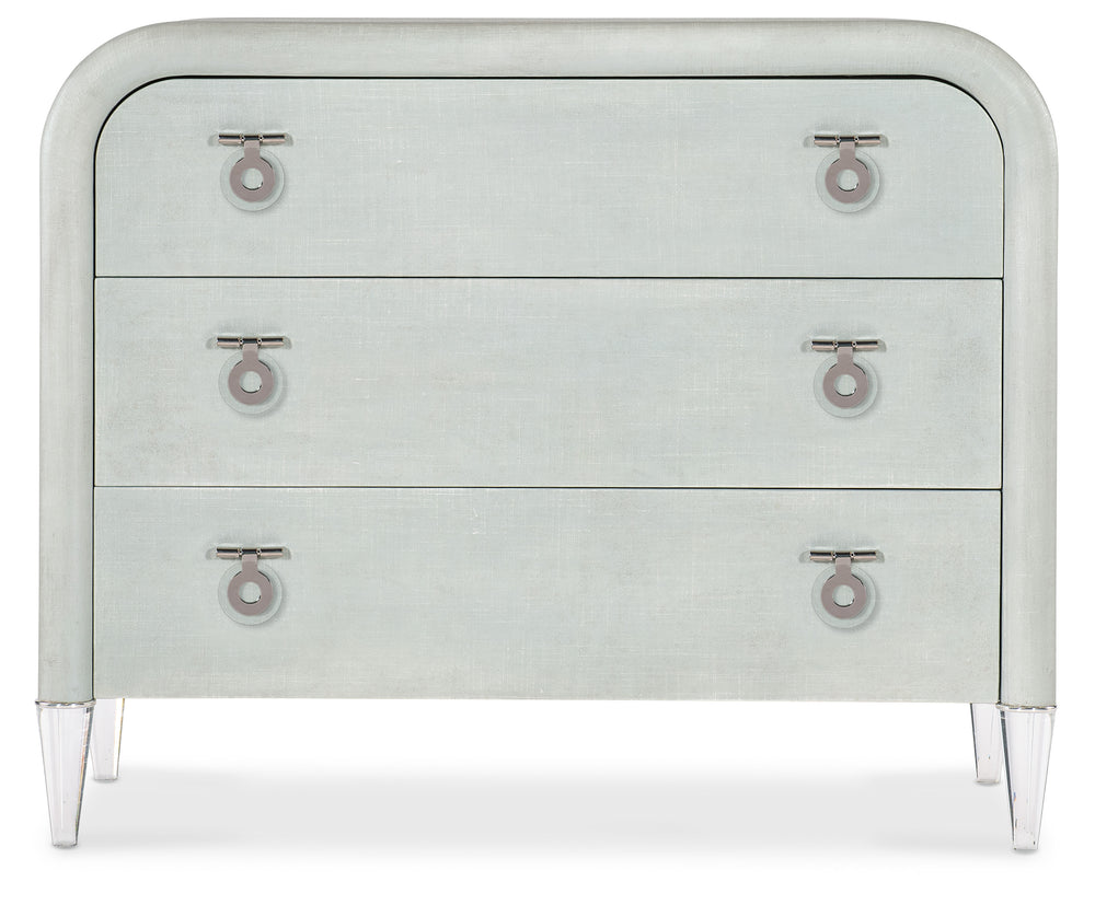 Light seafoam green linen exterior with clear acrylic legs and silver chrome-colored metal accents. Hardware is clear acrylic and chrome-colored metal drop pulls.