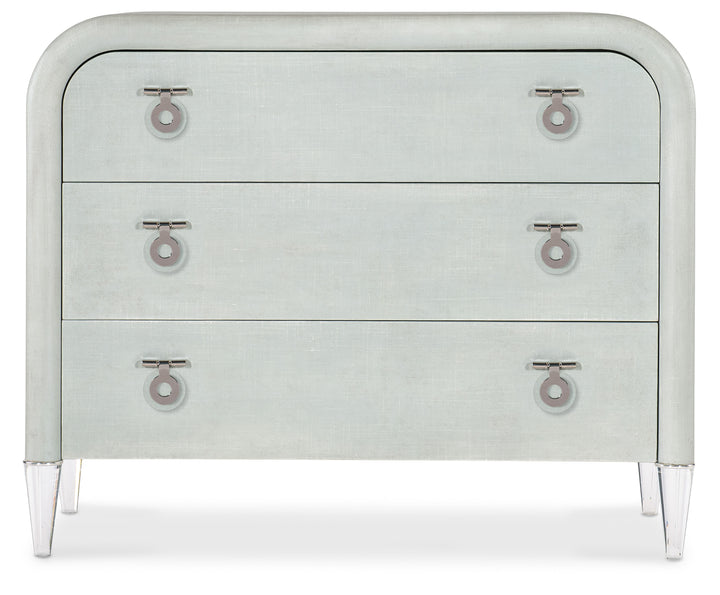 Light seafoam green linen exterior with clear acrylic legs and silver chrome-colored metal accents. Hardware is clear acrylic and chrome-colored metal drop pulls.