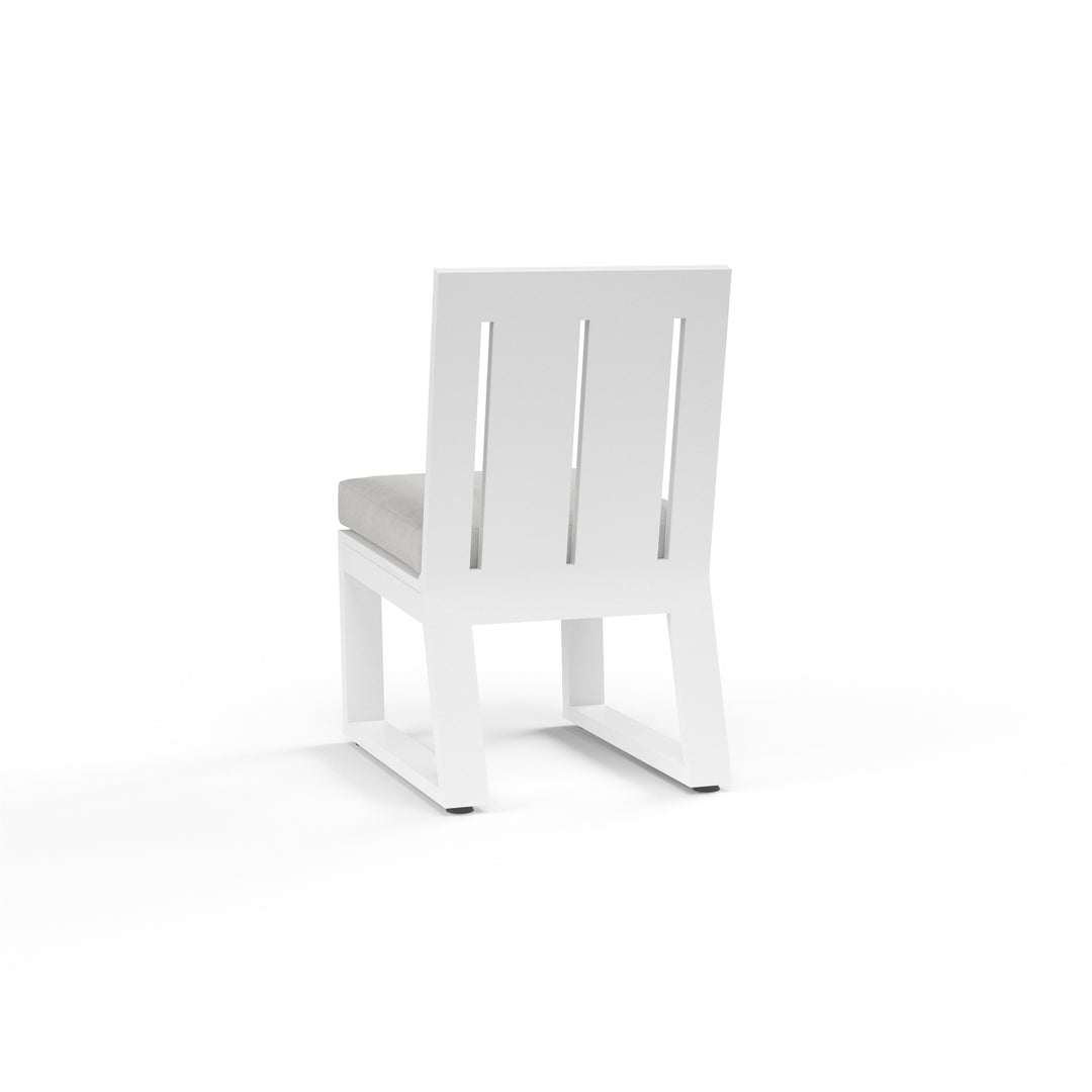 American Home Furniture | Sunset West - Newport Armless Dining Chair in Cast Silver, No Welt