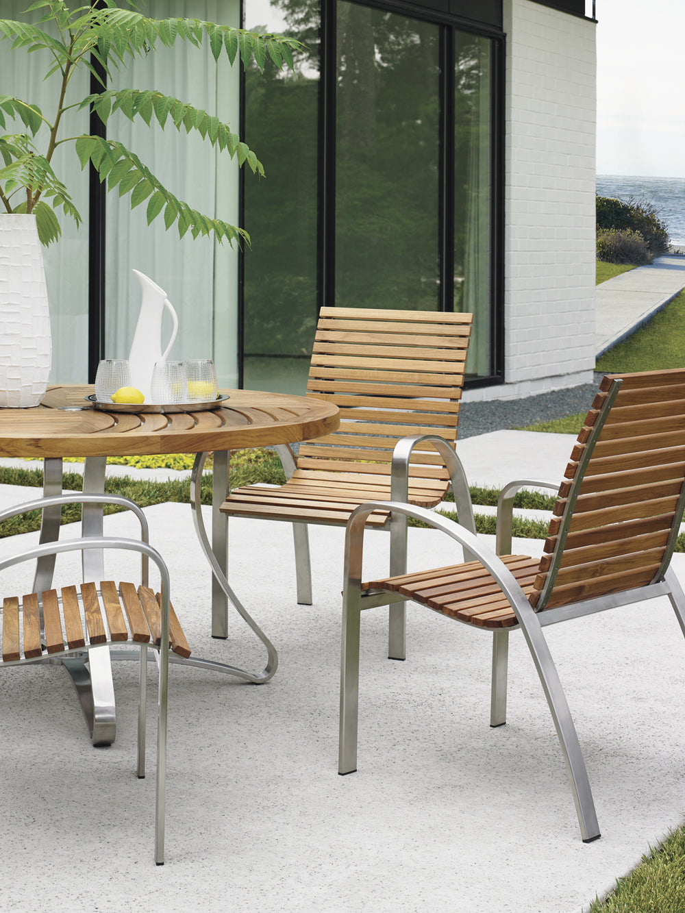American Home Furniture | Tommy Bahama Outdoor  - Tres Chic Arm Dining Chair