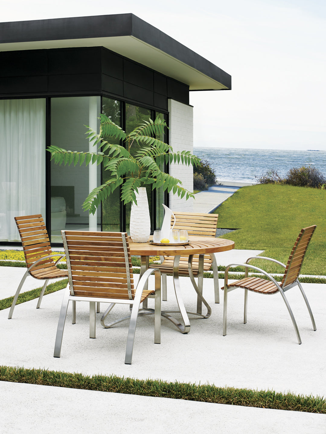 American Home Furniture | Tommy Bahama Outdoor  - Tres Chic Arm Dining Chair